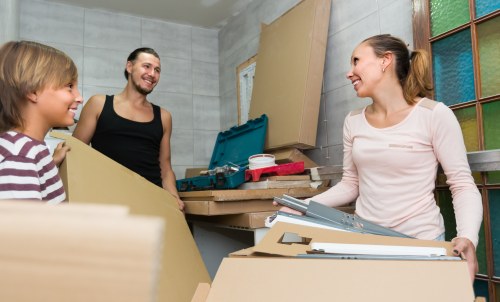 Removal team handling a flat move in Cranford with boxes and furniture