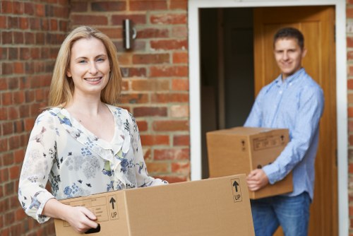 Mover packing belongings safely with protective blankets during a Cranford van service